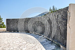 War memorial dedicated to 395 fallen Yugoslav partisans and civilians killed in Italian and ustasha concentration camps.