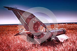 war plane crashed on shore of sea several years ago and lies on dunes