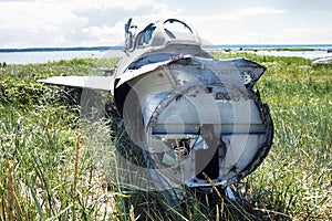 war plane crashed on shore of sea several years ago and lies on dunes