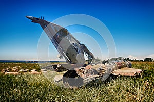 war plane crashed on shore of sea several years ago and lies on dunes