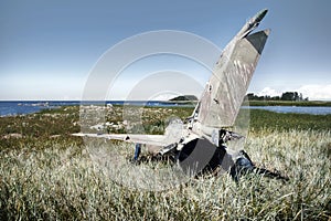 war plane crashed on shore of sea several years ago and lies on dunes