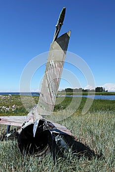 war plane crashed on shore of sea several years ago and lies on dunes