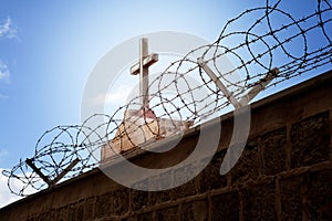 War and religion concept - Cross and barbed wire