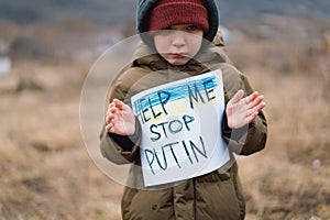 War of Russia against Ukraine. Crying boy asks to stop the war in Ukraine.