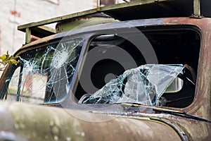 War truck with broken windshield glass outdoors