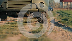 War in Ukraine. Military vehicle of the Ukrainian army. Close-up of Military Vehicle on Rough Terrain, Front section of