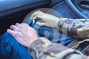 war veteran with artificial limb driving in a car