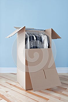 Wardrobe box with clothing, ready for moving