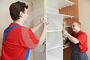 Wardrobe joiners at installation work