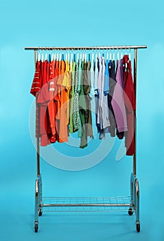 Wardrobe rack with different bright clothes