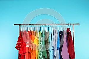 Wardrobe rack with different bright clothes