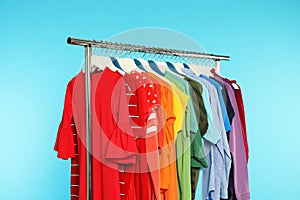 Wardrobe rack with different bright clothes