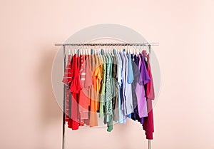 Wardrobe rack with different bright clothes