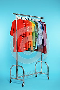 Wardrobe rack with different bright clothes