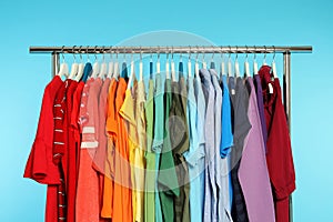 Wardrobe rack with different bright clothes