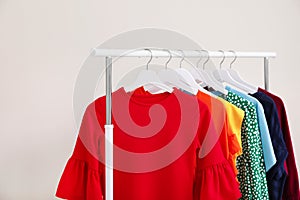 Wardrobe rack with different bright clothes