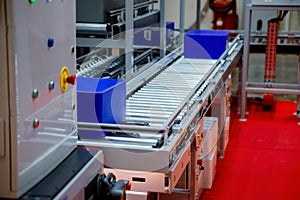 Warehouse automation. Automated conveyor lines with robotic manipulator