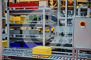 Warehouse automation. Automated conveyor lines with robotic manipulator