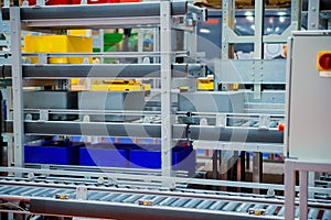 Warehouse automation. Automated conveyor lines with robotic manipulator