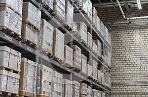 Warehouse with boxes on shelves and racks