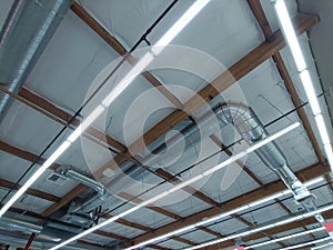 Warehouse Building Ceiling Lights and Ventilation Pipe and Wood Framing