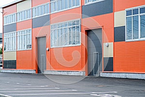 Warehouse building with lifting gates for entering trucks