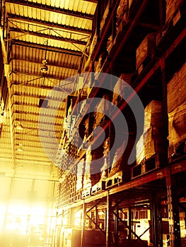 Warehouse cargo building store, warehouse interior with shelves, pallets and boxes for stock and sorting shipment goods in freight