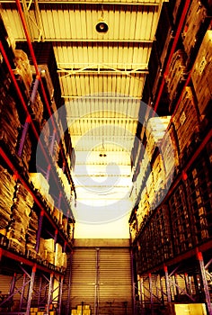 Warehouse cargo building store, warehouse interior with shelves, pallets and boxes for stock and sorting shipment goods in freight