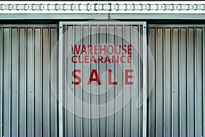 Warehouse clearance sale sign in metal wall