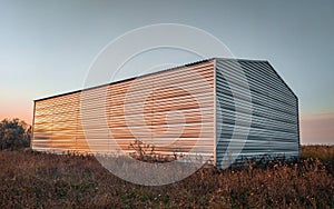 Warehouse constructed of corrugated galvanized iron.