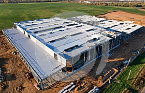 Warehouse Construction from metal structure. Industrial building on light gauge steel framing. Frame of modern hangar or factory.