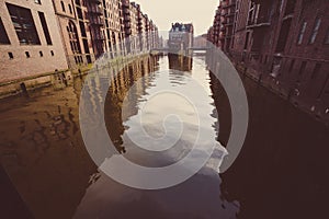 The Warehouse District - Speicherstadt in evening light. Tourism landmark of Hamburg. View of Wandrahmsfleet. Port of