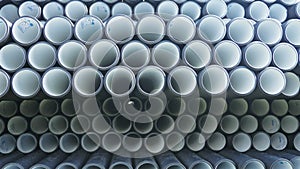 Warehouse of finished plastic pipes industrial outdoors storage site. Manufacture of plastic water pipes factory.