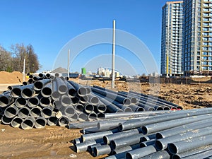 Warehouse of finished plastic pipes industrial outdoors storage site. Manufacture of plastic water pipes factory