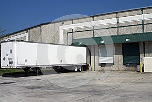 Warehouse loading bays with trailer photo