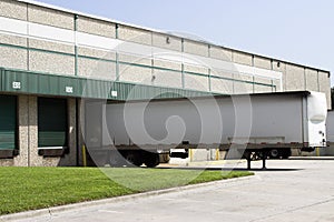 Warehouse loading bays with trailer photo