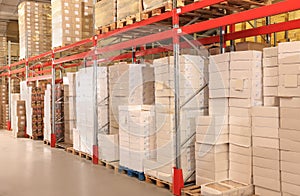 Warehouse with lots of boxes on racks. Wholesale business