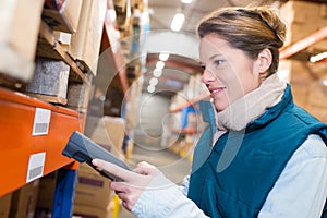Warehouse management system worker with barcode scanner