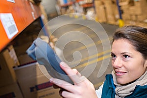 warehouse management system worker with barcode scanner