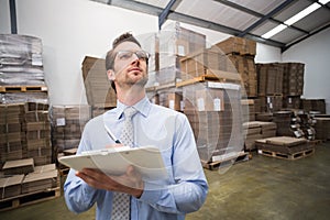 Warehouse manager checking his inventory