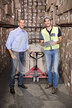 Warehouse manager and foreman working together