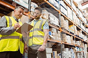 Warehouse manager speaking with foreman