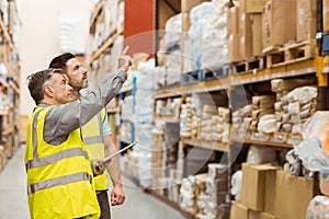 Warehouse manager talking with worker
