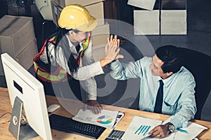 Warehouse manager and worker working in the storehouse