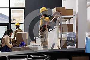 Warehouse managers team picking buyer order and choosing box