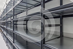 Warehouse racks storage metal pallet racking system in warehouse. Modern interior of new empty warehouse. The shelves are pallet