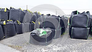 Warehouse with sacks exterior at factory of bulk cargo in jumbo bags