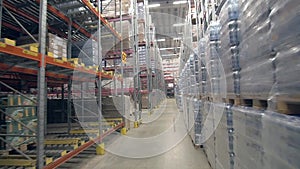 Warehouse with shelves full of various packages and goods