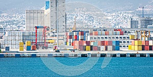 Warehouse and shipping container carriers at cargo port terminal