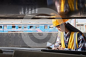 Warehouse staff checking equipment in the factory